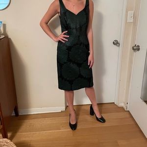 Leifsdotter black dress with shimmered green large floral pattern.